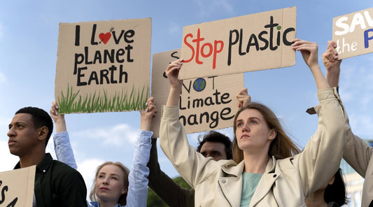Fighting Climate Change Means Fighting Plastics, highlights the specific message of the protest and the connection between plastic pollution and climate change